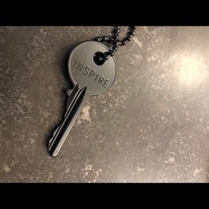 Key “Inspire” necklace on beaded chain.